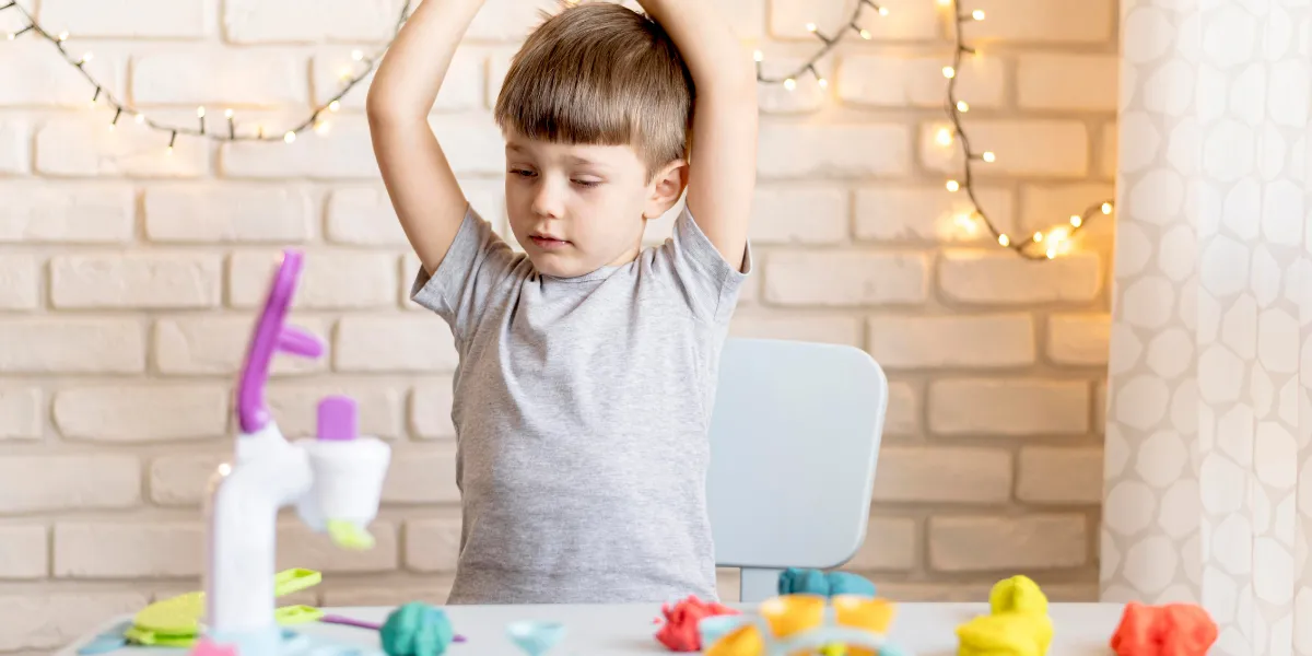 Child playing with playdo